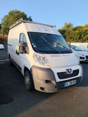 a white van that is parked in a parking lot