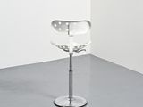an image of a chair in a room with a white wall