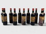 a group of six bottles of wine sitting next to each other
