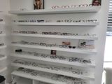 many glasses on the shelves in the store