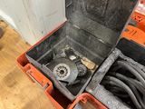 a box with a phone inside of it on the floor