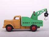 a toy truck with a crane attached to it ' s back