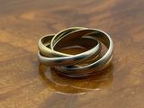 two rings sitting on top of a wooden table
