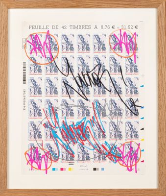 a framed photograph of a stamp with a lot of writing on it