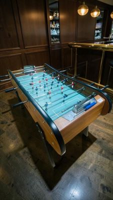 a foosball table in the middle of the room