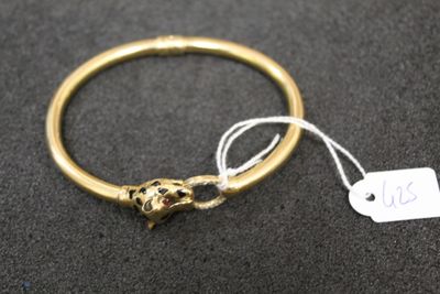 an image of a gold bracelet with a lion head on it