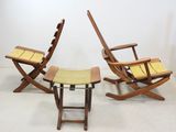 two chairs and a stool in a room with a white wall