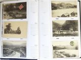 an open book with pictures of a river and mountains in it