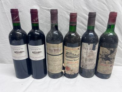 six bottles of wine are lined up on a table