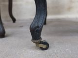 a close up of the legs of a chair with wheels