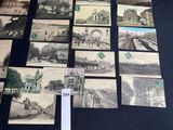 a lot of old black and white photos on the table