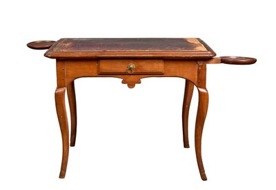 a small wooden table with a drawer on it