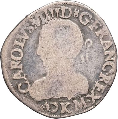a close up of a coin with a man ' s head on it