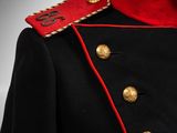 an image of a military uniform with a red collar and gold buttons
