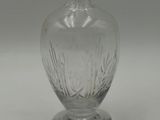 a clear glass vase that is sitting on a table
