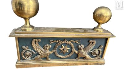 two golden vases sitting on top of a blue table