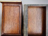 two wooden picture frames sitting next to each other on top of a table