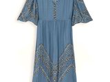 the dress is blue and has a pattern on it