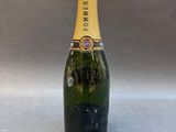 a bottle of champagne sitting on top of a table