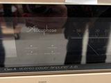 a microwave that is sitting on a counter with a price tag
