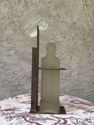 a lamp that is sitting on a table near a wall