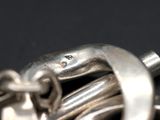 a close up of a metal object on a black surface
