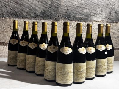 bottles of wine lined up in a row on a table