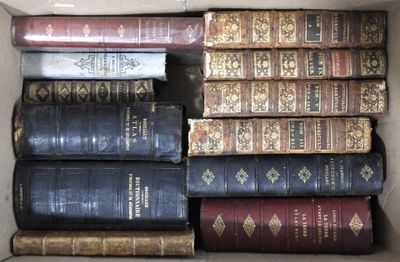 a box full of old books sitting on the floor