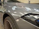 a close up of a car that has been painted silver
