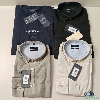 three men ' s dress shirts with tags on them sitting on a table
