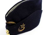 navy blue hat with a star and crescent on the side