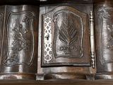 a close up of a wooden cabinet with a clock on it