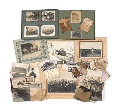 an assortment of old photographs and postcards on display on a white surface