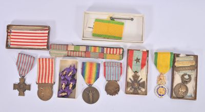 many medals and medals on display on a white surface