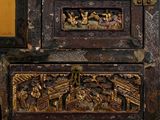 a very ornate wooden cabinet with gold decorations on it