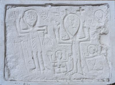 an image of a stone relief of a man and a woman with a child