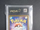 a close up of a pokemon card in a plastic case