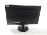 the back of a black computer monitor on a white surface