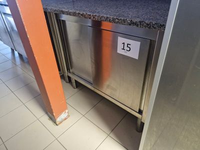 a stainless steel dishwasher in the middle of a kitchen