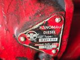 a close up of a red engine on a red vehicle