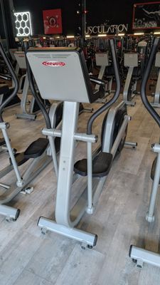 several stationary exercise bikes in a gym room