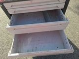 two drawers that are open on the ground