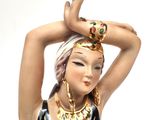 a figurine of a woman in a colorful dress