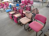many chairs that are lined up in a room