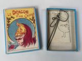 a small box with a book and a pair of scissors in it
