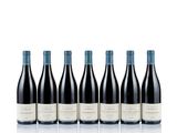 six bottles of red wine lined up in a row