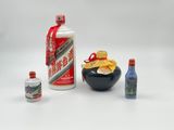 a bottle of alcohol, a bottle of beer, and a bottle of liquor