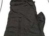 the pants are black in color and have zippers on them