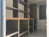 a room that has shelves and shelves in it