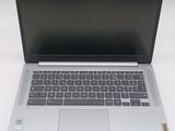 an open laptop computer sitting on top of a white table